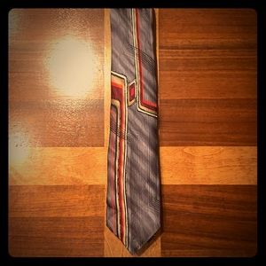 Grey tie with red and tan pattern